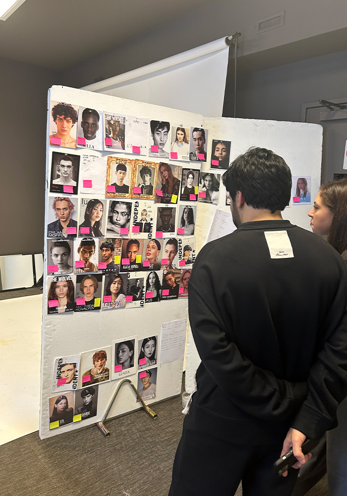 Dhruv Kapoor meticulously reviewing the lineup during the fitting at Istituto Marangoni Milano, Via Verri