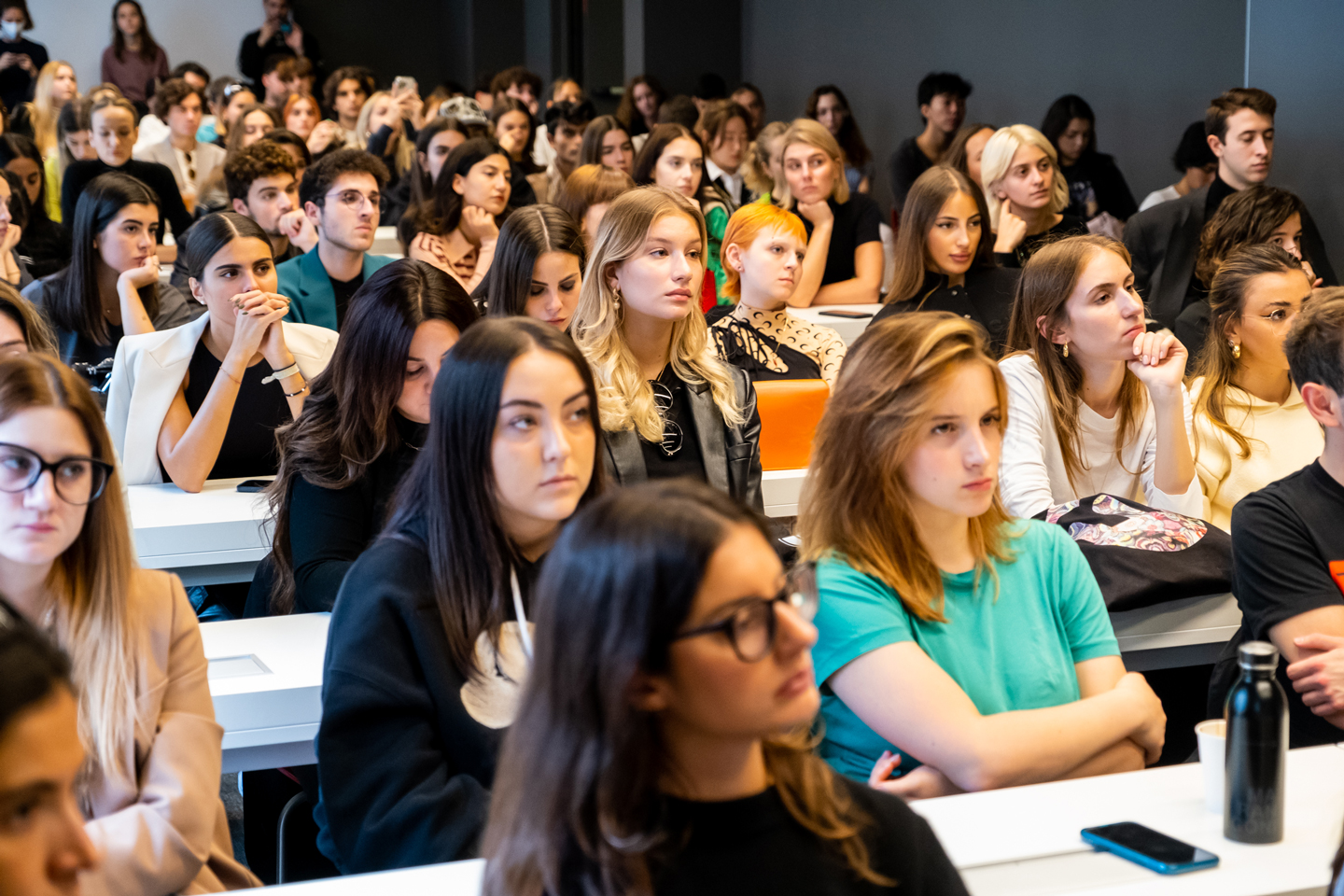 Students listening in to Calza talk about his life