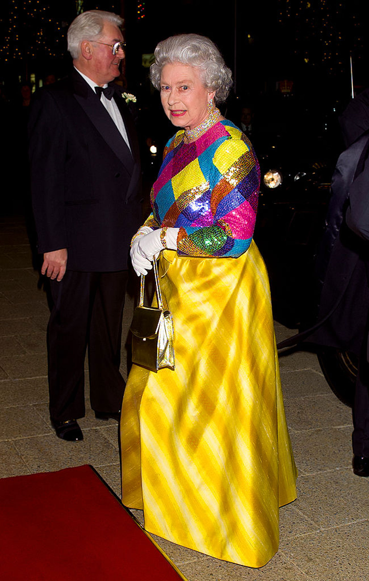 Queen Elizabeth II wearing one of her famous outfits, the "Harlequin Sequin Dress"