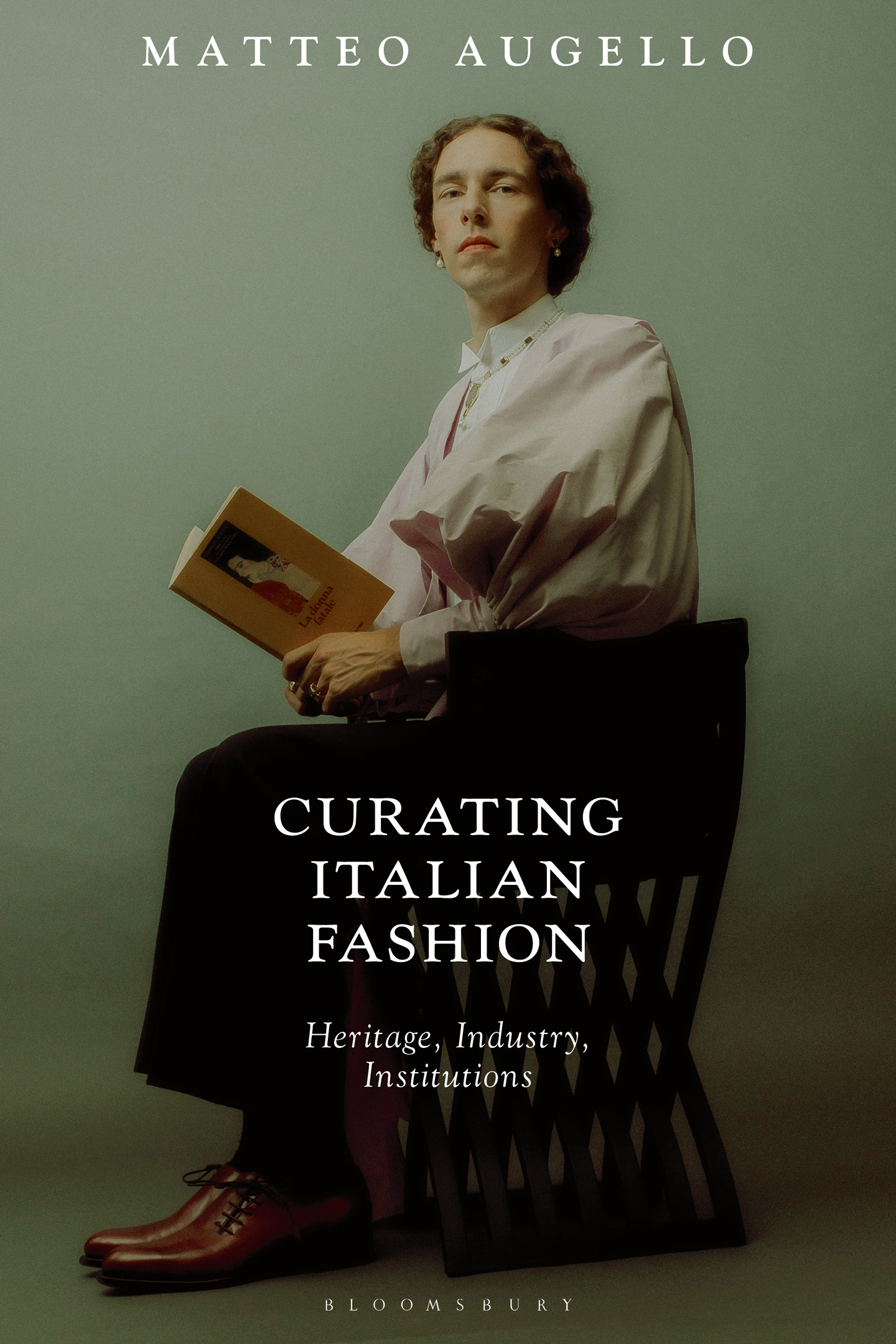 Book cover of Matteo Augello’s Curating Italian Fashion. Heritage, Industry, Institutions, published by Bloomsbury (2022). Photo courtesy of Daniele Fummo. All photographic material featured in this piece was taken at Istituto Marangoni London
