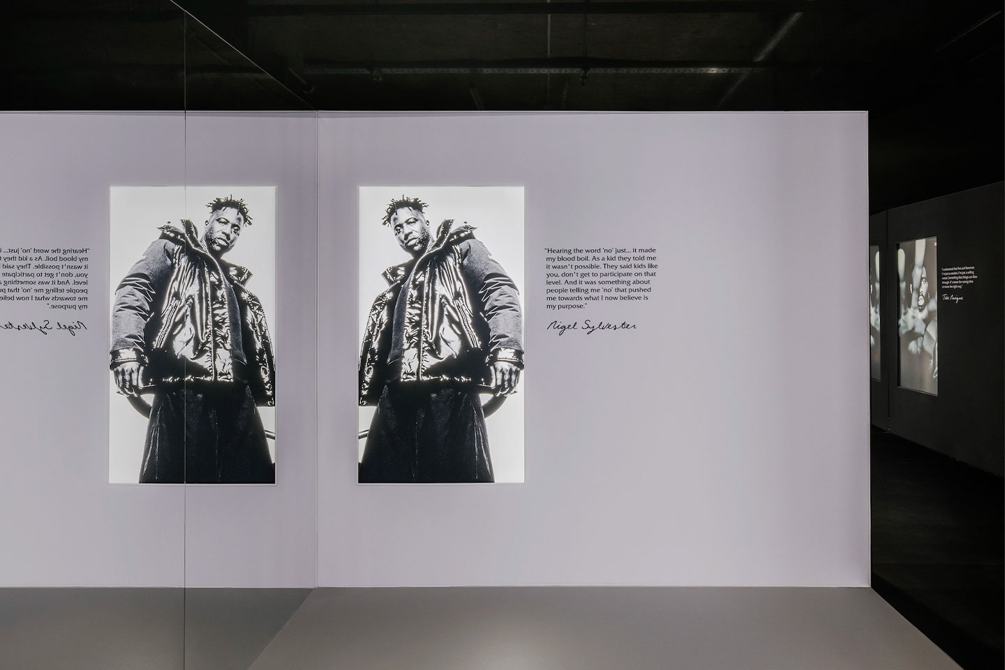 A hallway displaying the Moncler Maya 70 Collaborations photo series by Platon