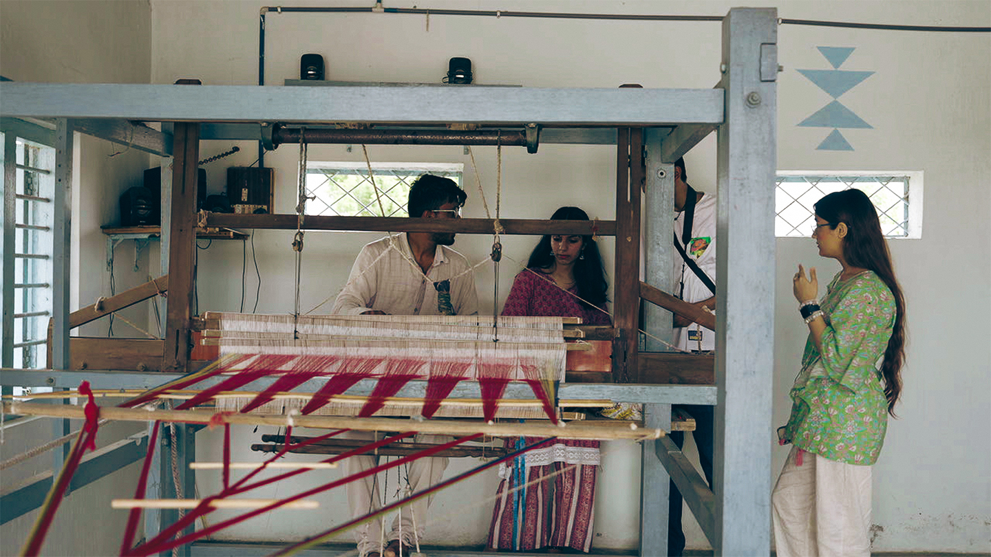 Crafting fabrics with a handloom, adorning them with various motifs