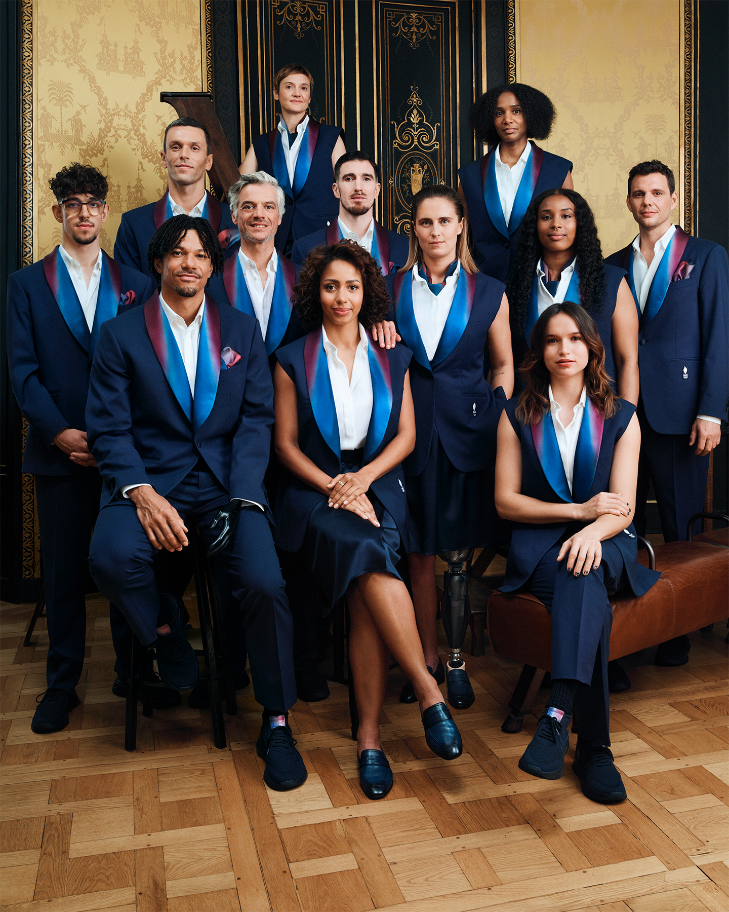 LVMH and Berluti revealed Team France’s outfits for the Opening Ceremonies of the Olympic and Paralympic Games Paris 2024. Left to right: Alexandre Léauté, Arnaud Assoumani, Alexis Hanquinquant, Karim Laghouag, Laure Thibaud-Obry, Estelle Mossely, Nando de Colo, Pauline Déroulède, Marie-Florence Candassamy, Gloria Agblemagnon, Oriane Bertone and Paul-Henri Mathieu. Photo by Kacper Kasprzyk, courtesy of Berluti