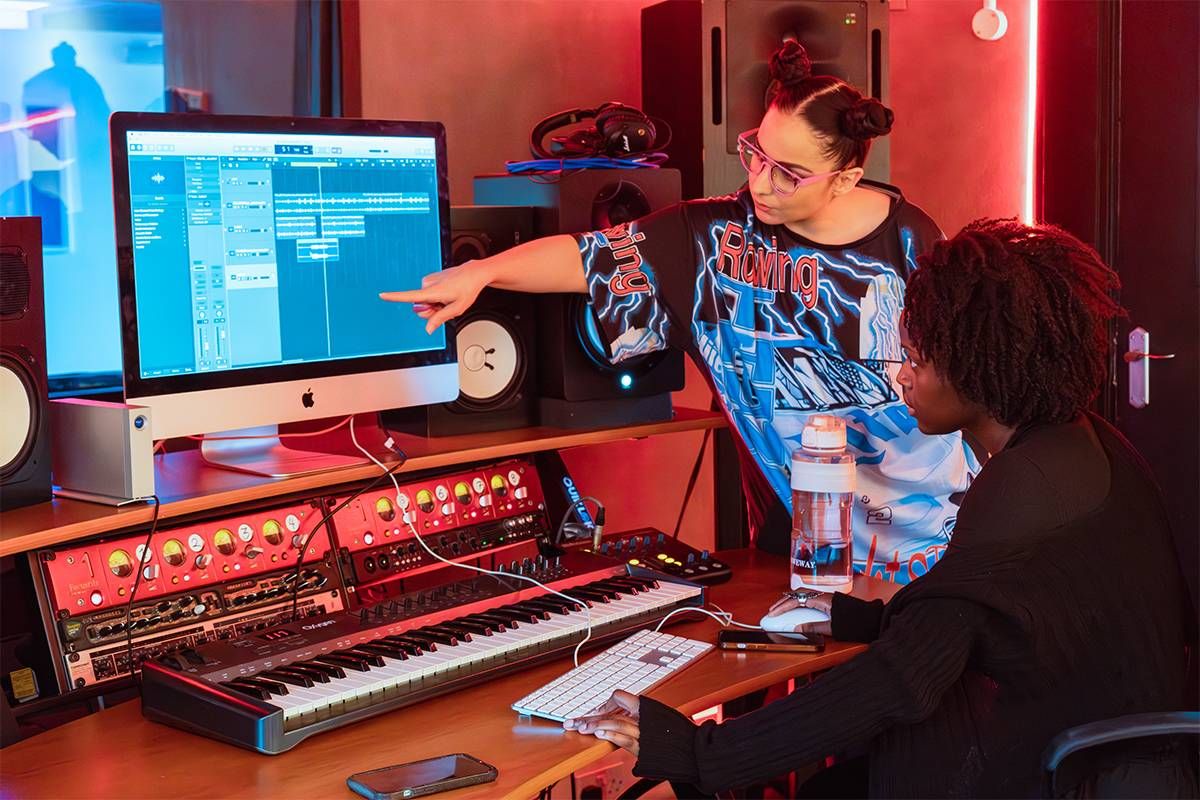 MC and Producer Laughta, working with a student in one of Raw Material’s two professional studios. Photo by Oliver McKanzie for Folios, Moleskine Foundation