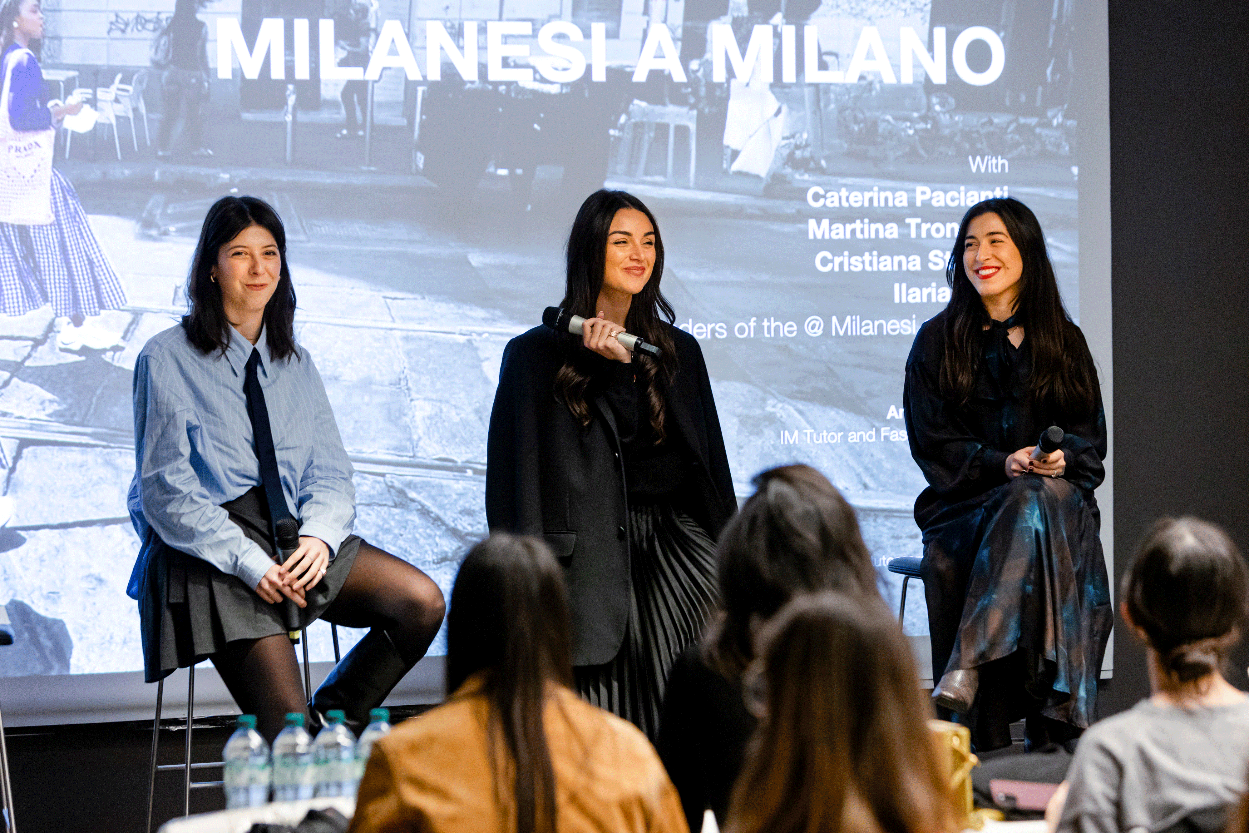 The young professionals behind the Instagram sensation 'Milanesi a Milano' discussing during the talk at Istituto Marangoni in Milan.