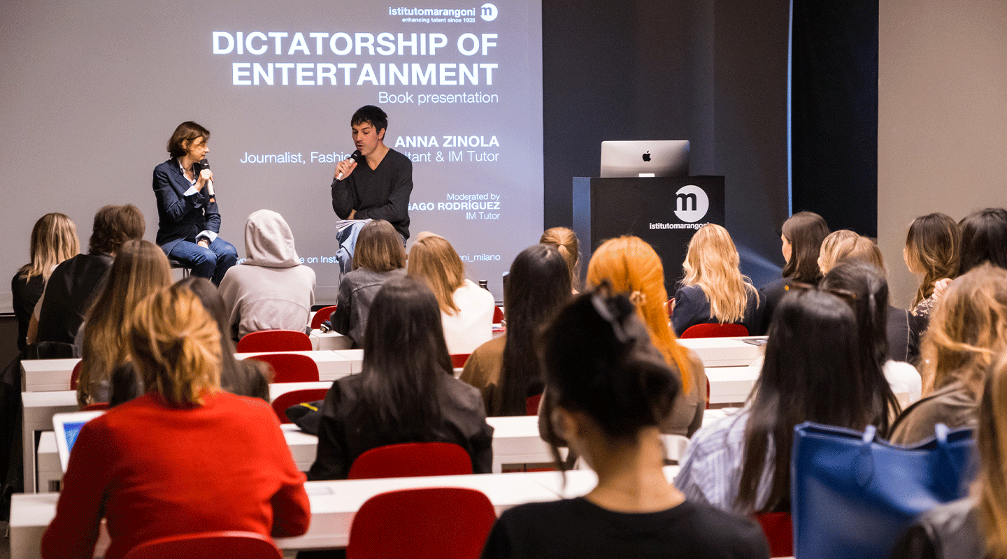 Anna Zinola, journalist and professor at Istituto Marangoni Milano, presenting her book "The Dictatorship of Entertainment" alongside Carlos Gago Rodriguez, fashion buyer and professor at Istituto Marangoni Milano