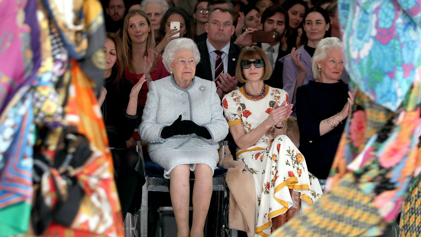 Queen Elizabeth II and Anna Wintour attend the Richard Quinn show during London Fashion Week February 2018 on February 20, 2018 in London, England