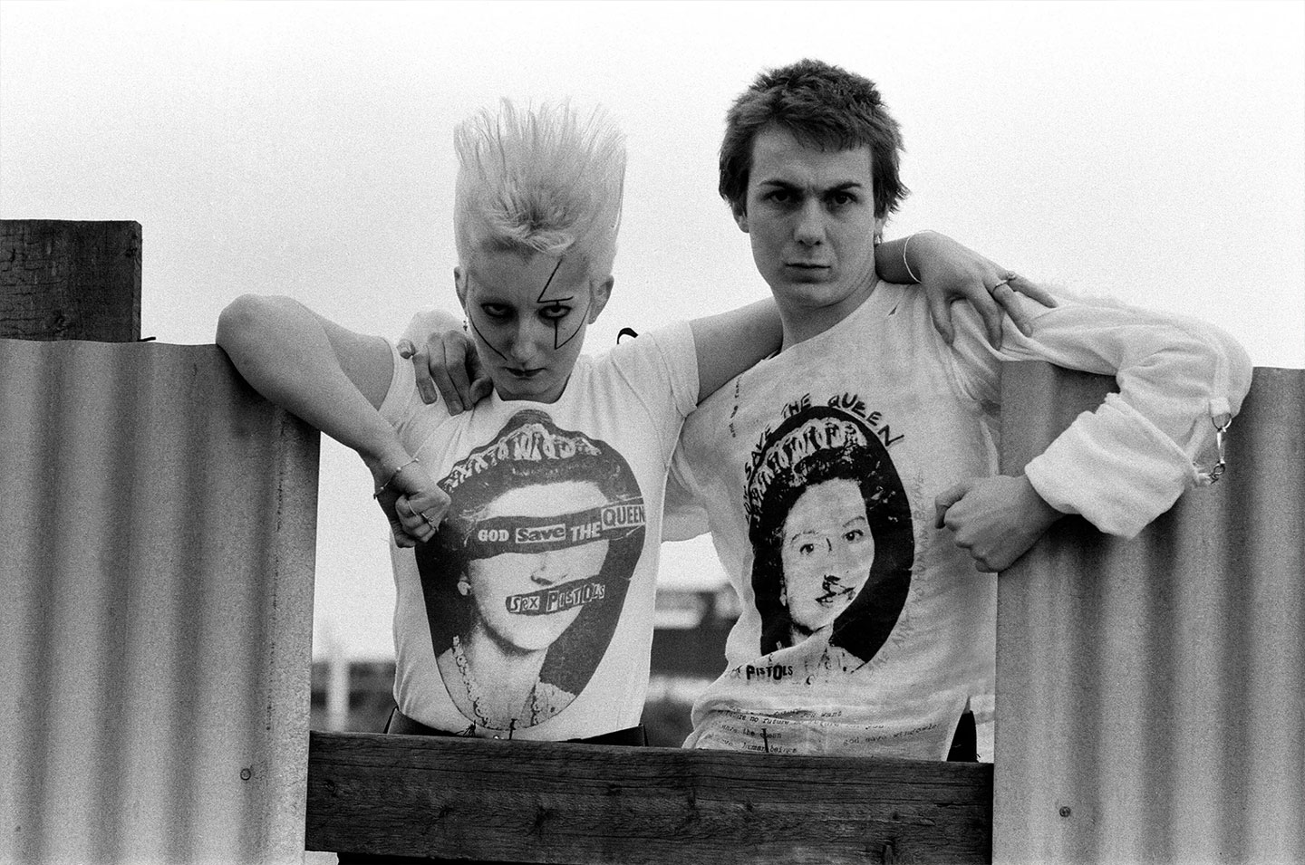 Clothing from the Seditionaries boutique on King's Road, London, 18th May 1977. Pamela Rooke (1955 - 2022), aka Jordan, and Simon Barker, aka Six, are modelling Sex Pistols 'God Save The Queen' T-shirts. Seditionaries, formerly known as Sex, is run by Vivienne Westwood and Malcolm McLaren