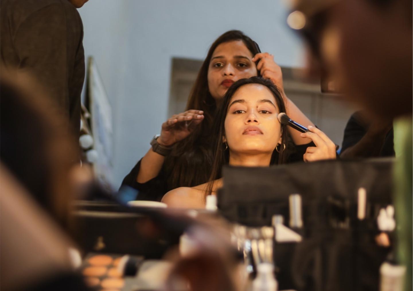 Final touches backstage at Omniverse 2022, the fashion showcase of Istituto Marangoni Mumbai's second-year students