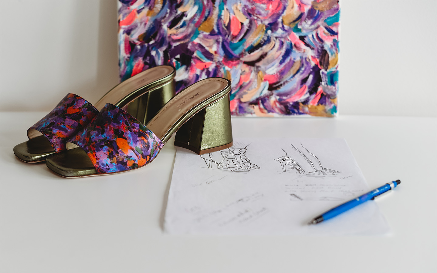 Each Laura See shoe features the brand's signature flash of artwork and a gold hummingbird on the sole